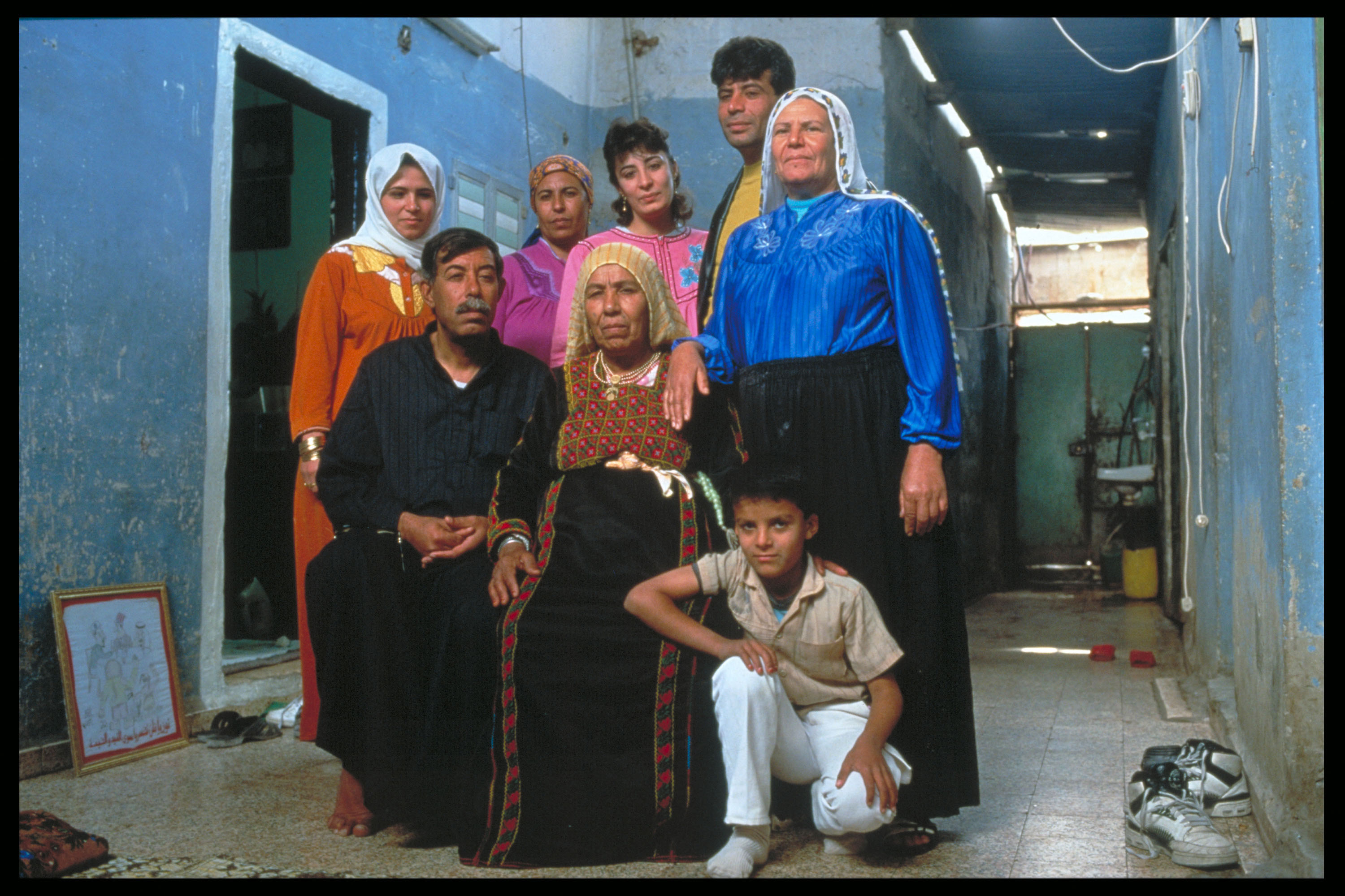 Image of "Gaza Strip, Palestine.": Shortly after the Oslo Peace Accords in 1993 till 2003, I took photographs in the Palestinian refugee camps of Jabalia, Khan Yunis and Deir al Balah in the Gaza Strip and portrayed young settlers attending religious classes in Newe Dekalim. The contrasts could not be greater: while everyday life on the Palestinian side was extremely difficult and painful, young occupying soldiers and settlers from Israel presented themselves proudly and confidently in front of their Jewish settlement in Gush Katif. This settlement was finally cleared and demolished in 2005.