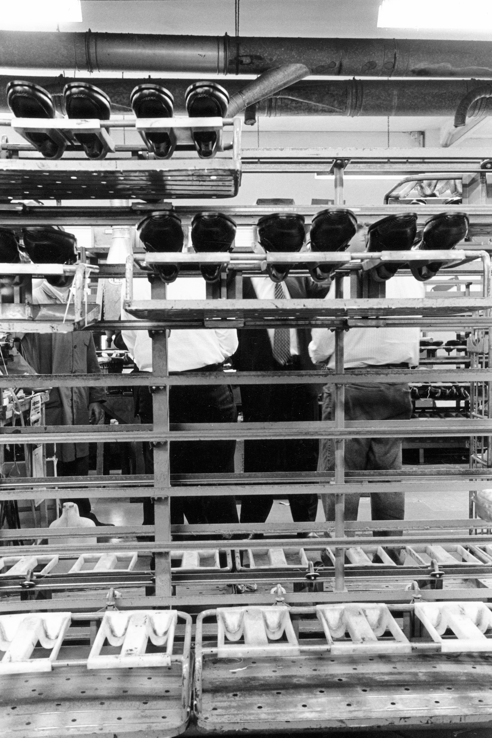Image of "A day in the world of work in Switzerland.": ...One o'clock in the morning. It's broad daylight at the dispatch office of the Bernese daily "der Bund" in Bümpliz. Azure-colored machines roll, collate, insert, and string against a cream-colored background.