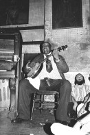 Image of sheet 19780120 photo 31: Preservation Hall Jazz Band is the name for numerous groups of Dixieland Jazz and traditional jazz bands at Preservation Hall in New Orleans, Louisiana, and on tours as organized by the Preservation Hall. The purpose of the Hall has been to preserve the heritage of both New Orleans traditional and Dixieland jazz music born in New Orleans and common to the Riverboats playing the Mississippi River, which spread throughout the South until the early 20th century.

Preservation Hall Jazz Konzert in N.O.Jazzsczene: Banjo: 'Father Al', Al Lewis. Trompet: Jabbo Smith, Drums: Louis Barbarin, Clarinet: Orange Kellin, Bass: James Prevost. Piano: Sweet Emma
New Orleans Vereinigte Staaten von Amerika USA U.S.A. 1978 √