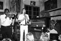 Image of sheet 19780120 photo 35: Preservation Hall Jazz Band is the name for numerous groups of Dixieland Jazz and traditional jazz bands at Preservation Hall in New Orleans, Louisiana, and on tours as organized by the Preservation Hall. The purpose of the Hall has been to preserve the heritage of both New Orleans traditional and Dixieland jazz music born in New Orleans and common to the Riverboats playing the Mississippi River, which spread throughout the South until the early 20th century.

Preservation Hall Jazz Konzert in N.O.Jazzsczene:Jazz, Jazzkonzert Banjo: 'Father Al', Al Lewis. Trompet: Jabbo Smith, Drums: Louis Barbarin, Clarinet: Orange Kellin, Bass: James Prevost. Piano: Sweet Emma
New Orleans Vereinigte Staaten von Amerika USA U.S.A. 1978 √