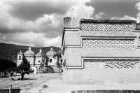 Image of sheet 19780160 photo 20: Mitla, Monte Alban,
(Zapotekische Kultur) Zapotheken um 1250 dann kamen die Mixteken.

Mitla is the second most important archeological site in the state of Oaxaca in Mexico, and the most important of the Zapotec culture. The site is located 44 km from the city of Oaxaca. in the upper end of the Tlacolula Valley, one of the three that form the Central Valleys Region of the state. The archeological site is within the modern municipality of San Pablo Villa de Mitla. While Monte Albán was most important as the political center, Mitla was the main religious center. The name Mitla is derived from the Nahuatl name Mictlán, which was the place of the dead or underworld. Its Zapotec name is Lyobaa, which means “place of rest.” The name Mictlán was Hispanicized to Mitla by the Spanish. However, what makes Mitla unique among Mesoamerican sites is the elaborate and intricate mosaic fretwork and geometric designs that cover tombs, panels, friezes and even entire walls. These mosaics are made with small, finely cut and polished stone pieces which have been fitted together without the use of mortar. No other site in Mexico has this. 1978 √
