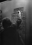 Image of sheet 19800091 photo 10: Ein Mann malt ein Graffiti 'Migros' waehrend am 21. April 1980 die Gruppe «Luft & Lärm» die Unterführung an der Langstrasse in Zuerich, besetzt. Demonstrationen