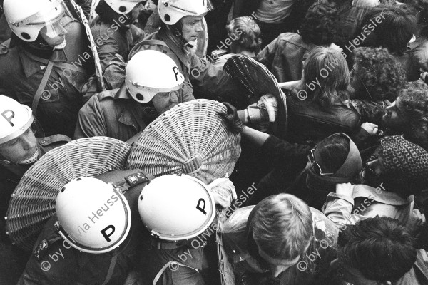 Image of sheet 19800160 photo 33: Policemen of Zürichs Anti demonstration patrool are fighting against manifestators who are demanding an Autonomous Youth Center in the town of Zürich.
The police break up a meeting by the so called members of the 'youth mouvement'. 1980

Jugendbewegung Bewegig Zürcher Jugendunruhen Demonstrationen 
Aus: Zürich, Sommer 1980
Im Bestand der Fotostiftung Schweiz 24 x 30 cm RC Vintage 1986.015
David Pujado 24 x 30 cm Baryt Vintage 2019
Exhibition: Belgrade Photo Month 2019, Photobastei 2.0 Zürich 2020,
Städtische Galerie Strauhof Zürich (Max Frisch),
Ja, wir kopieren! Strategien der Nachahmung in der Kunst seit 1970. Kunstmuseum Solothurn 1923.
(Kuratiert von Michael Hiltbrunner, Zürich).