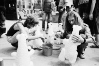 Image of sheet 19800322 photo 2: Im AJZ starten die Vorbereitungen für ein 1. August Fest auf dem Sechseläuten Platz mit anschliessender Unzufriedenen Demo. Die kleinen Sprite Werbe Bärchen dienen als Eisbären. Symbol, für das kalte Klima in der Stadt. Jedes trägt eine Bombe. Mit Zündschnur. Der Eisberg aus Styropor wird auch mitgetragen.  Die Leute sitzen in der Sonne. Ballone. 
Jugendbewegung Bewegig AJZ Zürcher Jugendunruhen Demonstrationen
Zürich youth movement protest 1980 √
© 1980, by OLIVIA HEUSSLER, / www.clic.li