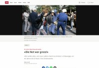 Image of sheet 19803000 photo 40: Jugendliche protestieren in einer Polit Performance, mit Korb-Schilder und Helm als Polizei Grenadiere verkleidet an der Bahnhofstrasse 1980 in Zuerich. Kreativ Action creative Action Jugendbewegung Youth Juerg Hasler filmt Movement Protest Art Polit Performance