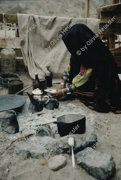 Image of sheet 19803002 photo 116: Beduin Woman preparing food in the Sinai Desert, Israel 1980.