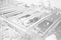 Image of sheet 19820160 photo 28: Die drei Ambulanzen aus der Schweiz werden den Eritreern an der Grenze zum Sudan in Erirtrea übergeben. Gruppenbild der Gruppe. Ein Röntgengerät wird
 transportiert. Durch ein Treppenhaus geschleickt. Elektrisch
 betriebene Kochtöpfe. Olivia kriegt neue Frisur. Zöpfchen. Auf
 einem Schiffsfrack, dass japanische Fahrzeuge transportiert hat liegt auf einem Korallenriff im roten Meer. Kissinger im Hotel El Nilein in Kharthoum Karthum. Afrikanischer Uhrenmacher. Sudan