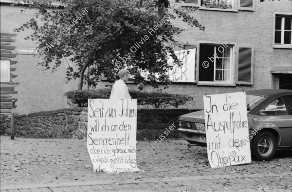 Image of sheet 19830250 photo 27: UBS Bank Hochhaus heute Steueramt Gebäude Werd Doppelbelichtung mit Tor zum Stauffacher. Besetzt. Bilder ab Monitor. Diabolik. Flugkörper. Protest gegen
 Verkehrslärm am Stauffacherstrasse im Erismannhof. Lasst uns ficken bevor wir ersticken. Bürger Innen Aktion. Zürich Kreis vier 4 Aussersihl 1983
© 1982, by Olivia Heussler www.oliviaheussler.com