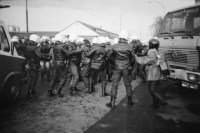 Image of sheet 19830300 photo 16: In Frankfurt Hausen ist eine Blockade gegen die Mittelstreckenraketen Depot im Gang. Die Polizei greift ein. Nachts werden die von der US- Armee bewachten Raketen in Containern weggefahren. Im Convoi fährt ein Rolls Royce 
Käthe Kollwitz Haus Strassentafel Frankfurt a. Main. Germany Deutschland 1983