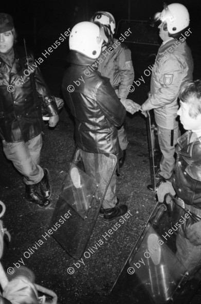 Image of sheet 19830300 photo 31: In Frankfurt Hausen ist eine Blockade gegen die Stationierung von nord amerikanischen Mittelstreckenraketen im Gang. Die Polizei greift ein. Nachts 
protest against deployment of U S Medium-range missiles
Frankfurt a. Main. Germany Deutschland 1983 √ 
© 1983, by OLIVIA HEUSSLER / www.clic.li