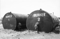 Image of sheet 19840150 photo 17: Sovietische Aerzte im sov. Spital in Chinandega. Gesundheitszentrum Spital der UDSSR SU mit Karte und Fotos. Tank mit Bunker gekennzeichnet. Sandinistischer Militär gibt den JournalistInnen Auskunft über Contraangriff gegen sovietisches Transportschiff. Portrait von Sohn Leo Gabriel. Mario. Managua Nicaragua 1984