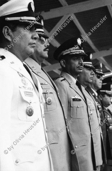 Image of sheet 19840190 photo 32: John Dimitri Negroponte (middle); born (July 21, 1939) is an American diplomat. He is currently a research fellow and lecturer in international affairs at Yale University's Jackson Institute for Global Affairs. Prior to this appointment, he served as the United States Deputy Secretary of State and as the first ever Director of National Intelligence.
US-Botschafter in Tegucigalpa.
'Puente Negro' gehört zum CIA Büro Zentralamerika. Militärparade in Las Tapias für die Befehlsstab übergabe an den neuen Armee General Walter Lopez Reyes 
Honduras Mittelamerika Centralamerica 1984 
√