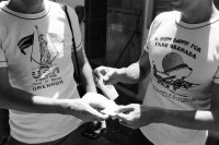 Image of sheet 19840260 photo 1: Leo Gabriel und Jan Schmeitz in T-Shirts. Managua Nicaragua 1984 √ 
two difrent opinions. against and in favor to the occupation of Granada by US military. in memory caribean revolution

USA & caribean friends thanks for rescuing Grenada
is written on the left tshirt.
on the right tshirt is written in memory to the revolution: 
A new dawn for free Grenada Anniversary of the Grenada Revolution 1979 - 1984