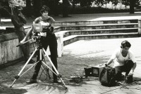 Image of sheet 19840510 photo 41: Sandinist Kommandant Cmdte. Daniel Ortega lässt sich für den Film von Hans Langenberg, (NL) interviewen. Gabriela Baur mit Camera filmt und Olivia Heussler als Tonfrau Technikerin Ton. Portrait. Nicaragua 1984 √ Journalismus Reportage