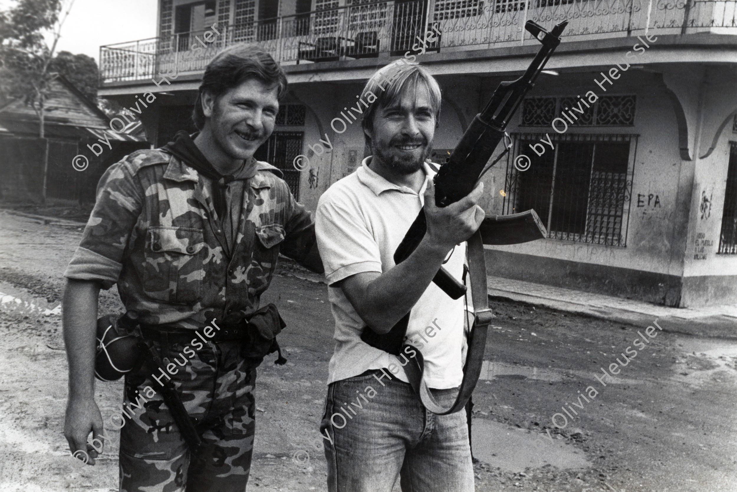 Image of sheet 19840620 photo 35: Uruguaian and austrian doctor in solidarity to the nicaraguan people. 
AK-47 Kalaschnikow. 
The AK-47 is a selective-fire, gas-operated 7.62×39mm assault rifle, first developed in the USSR by Mikhail Kalashnikov. It is officially known as Avtomat Kalashnikova (Russian: Автомат Калашникова). It is also known as a Kalashnikov, an AK-, or in Russian slang, Kalash.

Nicaragua, Región Autónoma del Atlántico Sur RAAS Nicaragua 1984 √
© 1984, by OLIVIA HEUSSLER / www.clic.li