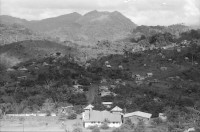 Image of sheet 19840680 photo 16: «Die schönsten Frauen in Nicaragua sind in Matagalpa und geben richtige Liebe» «Las Mujeres mas lindas de Nicaragua estan en Matagalpa y dan amor verdadero» steht auf einem Auto in Matagalpa geschrieben. Sandinistischer Militär Kommandant Alvaro Baltodano steht vor französischem Helikopter Aluette. Wir fliegen nach Waslala. In diesen  Folterkammern Kerkern wurden die Sandinisten hintuntergelassen und Tagelang eingesperrt gefoltert ohne Wasser und Nahrung. Folter. Waslala Uebersicht. Soldat liest. Portrait Frau schaut in Kamera. Lastwagen fährt durch Fluss. Soldaten. Portrait. Helikopter. Mi-8 Sovjetische Bauart. Maschinengewehr im Helikopter. Nicaragua 1984 

Aus: Der Traum von Solentiname/The dream of Solentiname/El sueño de Solentiname