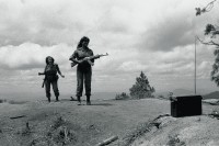 Image of sheet 19850170 photo 16: Zwei Frauen und Soldatinnen Soldat der sandinistischen Armee Militär Bataillon Veronica Lacayo tanzen mit Kalaschnikows soviet AK-47 an der Grenze zu Honduras zur Musik aus dem Kubanischen Transitor Radio. Las Segovias Nicaragua 04.85 1985 √ «Cerro 1300», Dpto. de Nueva Segovia, 1985

Out of: Der Traum von Solentiname / The dream of Solentiname / El sueño de Solentiname page 91

The AK-47 is a selective-fire, gas-operated 7.62×39mm assault rifle, first developed in the USSR by Mikhail Kalashnikov. It is officially known as Avtomat Kalashnikova (Russian: Автомат Калашникова). It is also known as a Kalashnikov, an "AK", or in Russian slang, Kalash.


Exhibition
gerahmt framed passepartout 37 x 52 cm