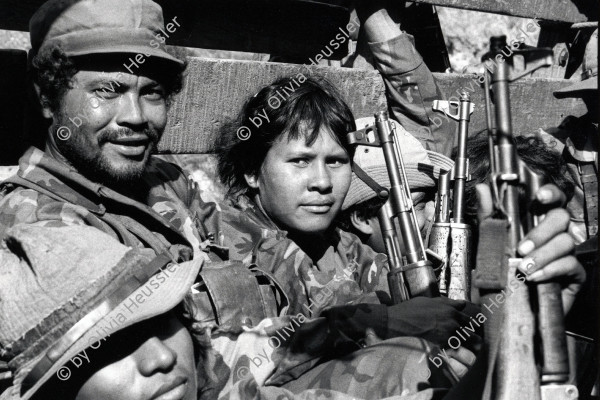 Image of sheet 19850170 photo 34: Eine junge Soldatin mit einer AK-47 der sandinistischen Armee in einem Lastwagen auf dem Weg an die Front. Las Segovias, Nicaragua 04.85 1985 √

The AK-47 is a selective-fire, gas-operated 7.62×39mm assault rifle, first developed in the USSR by Mikhail Kalashnikov. It is officially known as Avtomat Kalashnikova (Russian: Автомат Калашникова). It is also known as a Kalashnikov, an "AK", or in Russian slang, Kalash.
Exhibition