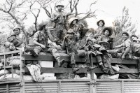 Image of sheet 19850310 photo 20: Der Tag der Demobilisierung des Frauenbataillons Veronica Lacayo nähert sich. Schon sind einige der Soldaten und Soldatinnen von der Front ins Basislager zurückgekommen. Sie sind ausgelaugt müde und glücklich.  Die Lastwagen werden gefüllt und ab gehts nach Hause, nach Leon, nach 9 Monaten Front Krieg in den Bergen. Frauenbataillon Veronica Lacayo, 
Leon Nicaragua 1985 √
The Sandinista Popular Army (or People's Army; Ejército Popular Sandinista, EPS) was the military established in 1979 by the new Sandinista government to replace the National Guard, following the overthow of Anastasio Somoza Debayle.

AK-47 Awtomat Kalaschnikowa, obrasza 47 (kyrillisch Автомат Калашникова образца 47), ein sowjetisch-russisches Sturmgewehr.
Aus: «Der Traum von Solentiname/The dream of Solentiname/El sueño de Solentiname»
Army Military EPS Ejército Popular Sandinista Soldier War Krieg FSLN