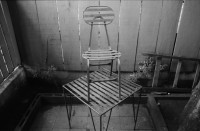 Image of sheet 19850430 photo 33: Selfmade chair on table, Restaurant Racachaca, Managua Nicaragua 1985.