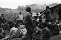 Image of sheet 19850510 photo 11: Nineth de Garcia is one of the founders of the Mutual Support Group (Grupo Apoyo Mutuo, or GAM) for relatives of the disappeared, Guatemala 1985.
Her husband Fernando was abducted three months before. But this group is not being formed simply to hold hands. They are supporting each other to protest the injustice of the disappearances.
Auf dem Weg und am Tag der Wahlen sind die Sekten-priester und Prediger der Evangelikalen an der Arbeit. Soldaten tauchen immer und überall auf. Am Atitlansee. In der Kirche von Atitlan feiern die IndianerInnen. Die Bauern betrinken sich masslos. Die Schlinge der Gehenkten soll für die Grossgrundbesitzer bereit sein. Eine Familie watet durch den Regen. Kinder in Trachten.
