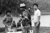 Image of sheet 19850510 photo 15: Nineth de Garcia is one of the founders of the Mutual Support Group (Grupo Apoyo Mutuo, or GAM) for relatives of the disappeared, Guatemala 1985.
Her husband Fernando was abducted three months before. But this group is not being formed simply to hold hands. They are supporting each other to protest the injustice of the disappearances.
Auf dem Weg und am Tag der Wahlen sind die Sekten-priester und Prediger der Evangelikalen an der Arbeit. Soldaten tauchen immer und überall auf. Am Atitlansee. In der Kirche von Atitlan feiern die IndianerInnen. Die Bauern betrinken sich masslos. Die Schlinge der Gehenkten soll für die Grossgrundbesitzer bereit sein. Eine Familie watet durch den Regen. Kinder in Trachten.