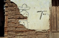 Image of sheet 19863000 photo 0: falsche Nummer, 000 gibt es nicht bei Dia
Wandmalerei an einem Lehmziegel-Haus zum 7. Jahrestag der Revolution. Managua, 1986
Aus: «Der Traum von Solentiname» EPF, Zürich 
«El Sueño de Solentiname» IHNCA Managua p.27