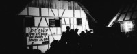 Image of sheet 19870270 photo 7: Besetzung des Freilicht Museums Ballenberg. am Eidg. Bettag. durch Protest Demonstration gegen die Wohnungsnot in Zürich. BesucherInnen in Trachten bestaunen die Transparente. «Die Häuser den Menschen die darin wohnen» Oder:«Die einen sind am Ballen die anderen stehen am Berg» Am Riegelhaus. Olivia nach Weisheits Zahn entfernung. Selbstportrait. 1987 Zürich Bern

Ballenberg is an open air museum in Switzerland that displays traditional buildings and architecture from all over the country. Located near Brienz in the municipality of Hofstetten bei Brienz, Canton of Berne, Ballenberg has over 100 original buildings that have been transported from their original sites