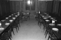 Image of sheet 19870350 photo 2: Hausbesetzung Besetzung Restaurant Annaburg Üetliberg Uetliberg. Gedeckte Tische. M. S beim Kochen. Annaburg mit Beleuchtung im Nebel. und Transparent; 
Annaburg wieder bewohnt Uetliberg 
Stop Pigs
Barrikade mit Stühlen. und Tischen. tomi hämmerli haemmerli und Feuer auf dem Weg gegen die Polizei. Frühstück Zürich 1987 housing occupation occupied house home protest swiss switzerland Schweiz Europe