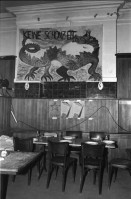 Image of sheet 19870350 photo 3: Hausbesetzung Besetzung Restaurant Annaburg Üetliberg Uetliberg. Gedeckte Tische. M. S beim Kochen. Annaburg mit Beleuchtung im Nebel. und Transparent; 
Annaburg wieder bewohnt Uetliberg 
Stop Pigs
Barrikade mit Stühlen. und Tischen. tomi hämmerli haemmerli und Feuer auf dem Weg gegen die Polizei. Frühstück Zürich 1987 housing occupation occupied house home protest swiss switzerland Schweiz Europe