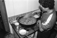 Image of sheet 19870350 photo 4: Hausbesetzung Besetzung Restaurant Annaburg Üetliberg Uetliberg. Gedeckte Tische. M. S beim Kochen. Annaburg mit Beleuchtung im Nebel. und Transparent; 
Annaburg wieder bewohnt Uetliberg 
Stop Pigs
Barrikade mit Stühlen. und Tischen. tomi hämmerli haemmerli und Feuer auf dem Weg gegen die Polizei. Frühstück Zürich 1987 housing occupation occupied house home protest swiss switzerland Schweiz Europe