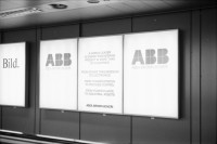 Image of sheet 19880330 photo 12: Plakate mit Frauenfeindlicher Reklame. Im Erismannhof steht Hallo Margrit du schöne Frauen - Wandmalerei. ABB Reklame im Flughafen Zürich. 
In Kreta mit Rudi Berli. Portrait. Frau studiert Todesanzeigen. Plakat der Nea Democratica. Mit Cathy auf dem Boot. mit Costa. Portrait Olivia. Haus typisch. Cathy und Mann X am Strand. Touristen Souvenir auf Autokühlerhaube. Dorf. Xania
Griechenland 1988