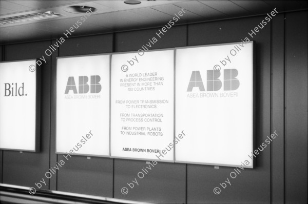 Image of sheet 19880330 photo 12: Plakate mit Frauenfeindlicher Reklame. Im Erismannhof steht Hallo Margrit du schöne Frauen - Wandmalerei. ABB Reklame im Flughafen Zürich. 
In Kreta mit Rudi Berli. Portrait. Frau studiert Todesanzeigen. Plakat der Nea Democratica. Mit Cathy auf dem Boot. mit Costa. Portrait Olivia. Haus typisch. Cathy und Mann X am Strand. Touristen Souvenir auf Autokühlerhaube. Dorf. Xania
Griechenland 1988