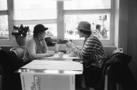 Image of sheet 19880870 photo 7: Schnee im Kreis 5 fünf Im Café am Helvetiaplatz. Eingepacktes Haus in Renovation. Mann Liest im Tram Strassenbahn. Portrait Antonio Turok der mexikanischer Photographer Photography Fotograf. Ich schenkte ihm ein T-Shirt
 'Political Asylum'. In meiner Küche im Erismannhof. Ich schneide ihm seinen Zopf. Im Stray Cats trinken wir Champagner .alles Leica M4 Test Zürich Aussersihl Kreis vier Switzerland housing