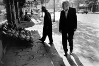 Image of sheet 19890650 photo 13: man in front of a shop man looks at the selection of the store Angebot