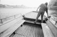 Image of sheet 19890910 photo 4: Am Rhein. Auf einem Fährschiff fotografiere ich Fatima Heussler. AKW Gösgen AG aus dem fahrenden Zug. Mit Dampfwolke. Hund auf Fähre. Basel 1989