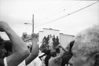 Image of sheet 19900390 photo 1: In Esteli Nicaragua wird zum ersten Mal nach der Machtübernahme von Violetta Chamorro, 1. Mai 'gefeiert'. Ich gehe mit Juanita Brüssel und Bayardo Gamez und Uriel Sotomayor und Donaldo Altamirano. Die Leute stehen vor der Wandmalerei von Nordamerikanischen Künstlern Muralistas Mural. Gruppenbild. Flughafen Santo Domingo. Platte von Papst.' Su Santidad Juan Pablo II demonstro su amor  al pueblo dominicano al besar con humildad este lugar el dia 25 de enero de 1979'. 
Frauenhandel. Junge Frauen warten auf ihren Abflug nach Europa, wo sie als Animierdamen und Prostituierte Frauenhandel arbeiten werden oder schon verheiratet wurden. Flughafen Madrid Spanien
Fäuste vor der Nationalbank am Bundesplatz. Protest Kurden Kurds Kurdinnen. Ein Lastwagenfahrer isst sein Mittagessen neben seinem Lastwagen. Portrait Doppelbelichtung Meine Mutter Ruth Guggenheim Heussler zum 70 Geburtstag. Zürich 1990