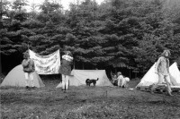 Image of sheet 19900540 photo 4: Das Waffenplatzgegner Camp steht kurz vor der polizeilichen Räumung. Zwischen den Zelten stehen zwei Holz plastiken. Skulpturen aus Holz. Protest. 1990 Neuchlen Anschwilen St. Gallen Schweiz Waffenplatz Gewaltfreie Aktion Militär military army armee protest √ Europe Transparent politisches Plakat dog hund Zeltcamp Protestcamp Zeltplatz Zelte 

The opponents camp is about to be cleared by the police. Between the tents stand two wooden sculptures. Switzerland protest against military Swiss camp anti militaris banner