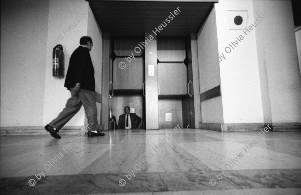 Image of sheet 19900710 photo 10: Das Reichsluftfahrtministerium (RLM) war ein Ministerium in der Zeit des Dritten Reichs. Für dieses Ministerium wurde 1935 ein monumentales Bürogebäude in Berlin errichtet, das seit 1992 Detlev-Rohwedder-Haus heißt und heute Sitz des Bundesministeriums der Finanzen ist.
Pater Noster Lift  DDR GDR Ost Berlin 1990
The Ministry of Aviation (German: Reichsluftfahrtministerium, RLM) was a government department during the period of Nazi Germany (1933–45). It is also the original name of a building in Wilhelmstraße in central Berlin, the capital of Germany, which now houses the Bundesministerium der Finanzen (German Finance Ministry).
 ehemaliger Arbeitsraum von Göhring. Kleiner Festsaal. Nr. 16
 Fanta und Coca Cola ! Kunst am Bau von Levandowski. Schnitt.
 Reichsadler im Brückengeländer.Elbe.? 
Markthalle am Alexander Platz. Eingang von Via Lewandovsky 1990 von Gruppe Atoperforationskünstler. Bild im Innern 'Lohn der Arbeit'.