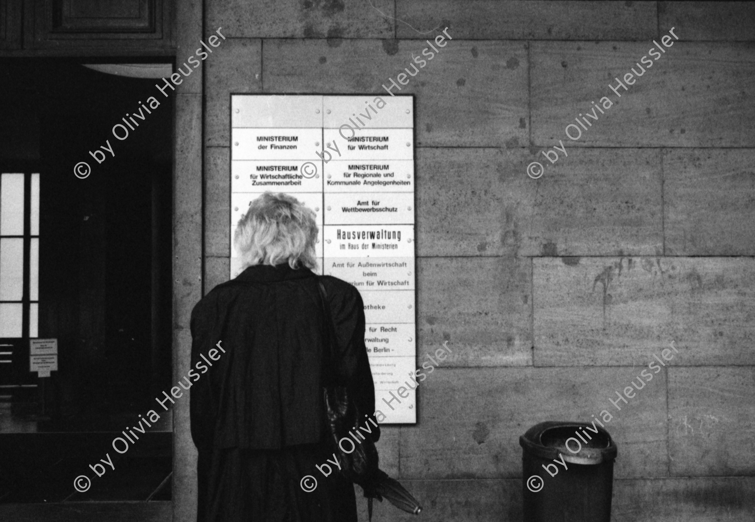 Image of sheet 19900710 photo 18: Das Reichsluftfahrtministerium (RLM) war ein Ministerium in der Zeit des Dritten Reichs. Für dieses Ministerium wurde 1935 ein monumentales Bürogebäude in Berlin errichtet, das seit 1992 Detlev-Rohwedder-Haus heißt und heute Sitz des Bundesministeriums der Finanzen ist.
Pater Noster Lift  DDR GDR Ost Berlin 1990
The Ministry of Aviation (German: Reichsluftfahrtministerium, RLM) was a government department during the period of Nazi Germany (1933–45). It is also the original name of a building in Wilhelmstraße in central Berlin, the capital of Germany, which now houses the Bundesministerium der Finanzen (German Finance Ministry).
 ehemaliger Arbeitsraum von Göhring. Kleiner Festsaal. Nr. 16
 Fanta und Coca Cola ! Kunst am Bau von Levandowski. Schnitt.
 Reichsadler im Brückengeländer.Elbe.? 
Markthalle am Alexander Platz. Eingang von Via Lewandovsky 1990 von Gruppe Atoperforationskünstler. Bild im Innern 'Lohn der Arbeit'.