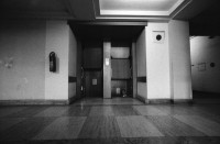 Image of sheet 19900710 photo 5: Das Reichsluftfahrtministerium (RLM) war ein Ministerium in der Zeit des Dritten Reichs. Für dieses Ministerium wurde 1935 ein monumentales Bürogebäude in Berlin errichtet, das seit 1992 Detlev-Rohwedder-Haus heißt und heute Sitz des Bundesministeriums der Finanzen ist.
Pater Noster Lift  DDR GDR Ost Berlin 1990
The Ministry of Aviation (German: Reichsluftfahrtministerium, RLM) was a government department during the period of Nazi Germany (1933–45). It is also the original name of a building in Wilhelmstraße in central Berlin, the capital of Germany, which now houses the Bundesministerium der Finanzen (German Finance Ministry).
 ehemaliger Arbeitsraum von Göhring. Kleiner Festsaal. Nr. 16
 Fanta und Coca Cola ! Kunst am Bau von Levandowski. Schnitt.
 Reichsadler im Brückengeländer.Elbe.? 
Markthalle am Alexander Platz. Eingang von Via Lewandovsky 1990 von Gruppe Atoperforationskünstler. Bild im Innern 'Lohn der Arbeit'.