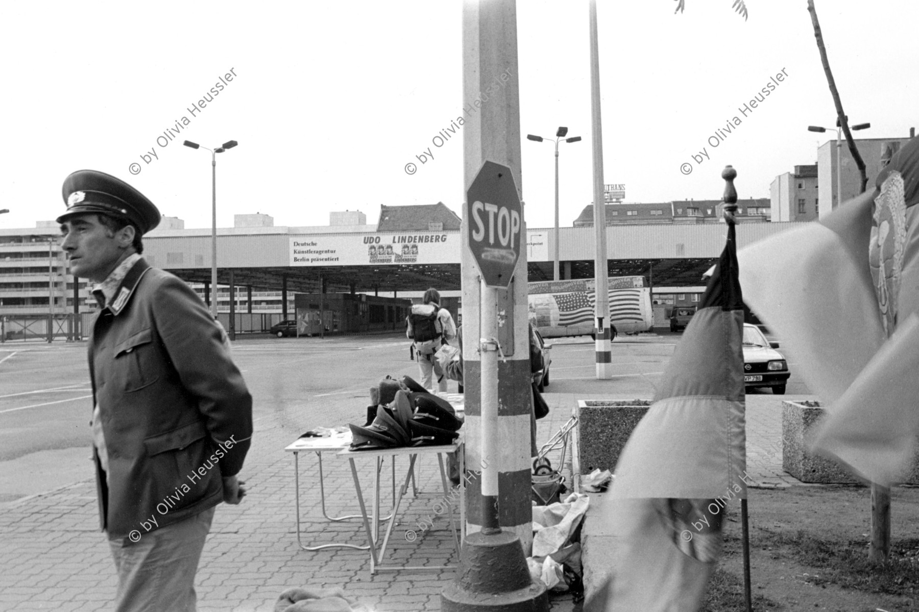 Image of sheet 19900720 photo 13: Nach der Wende verkaufen Leute aus dem Osten altes Militärmaterial am Checkpoint Charlie, Berlin 1990. Germany former ddr EX-DDR
Former Chepoint Wallborder to Eas-Germany GFR. An old Polish Citizen is sitting near old military uniforms from various Eastern Countries. The Pole is selling thes uniforms to travellers who visit whatever is left over from the 'Wall'.