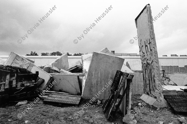 Image of sheet 19900740 photo 23: Germany wall √ 

The Berlin Wall (German: Berliner Mauer) was a barrier constructed by the German Democratic Republic (GDR, East Germany) starting on 13 August 1961, that completely cut off (by land) West Berlin from surrounding East Germany and from East Berlin. The barrier included guard towers placed along large concrete walls, which circumscribed a wide area (later known as the "death strip") that contained anti-vehicle trenches, "fakir beds" and other defenses. The Eastern Bloc claimed that the wall was erected to protect its population from fascist elements conspiring to prevent the "will of the people" in building a socialist state in East Germany. In practice, the Wall served to prevent the massive emigration and defection that marked Germany and the communist Eastern Bloc during the post-World War II period