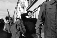Image of sheet 19900790 photo 15: Junger Demonstrant verdeckt sich Augen und Gesicht während einer Polizeikontrolle am Protest gegen die Feierlichkeiten zur Wiedervereinigung von Ost- und Westdeutschland in Berlin, 02.Okt. 1990.  Deutschland vor der Wende.
Young left-winged activist is covering his face with his hand to keep his identity from whoever tries to take pictures from him. This reaction is the consequence of continuing police control in Berlin s streets. Especially as there is also a "Anti Reunification Movement" in Berlin. Police control protest manifester