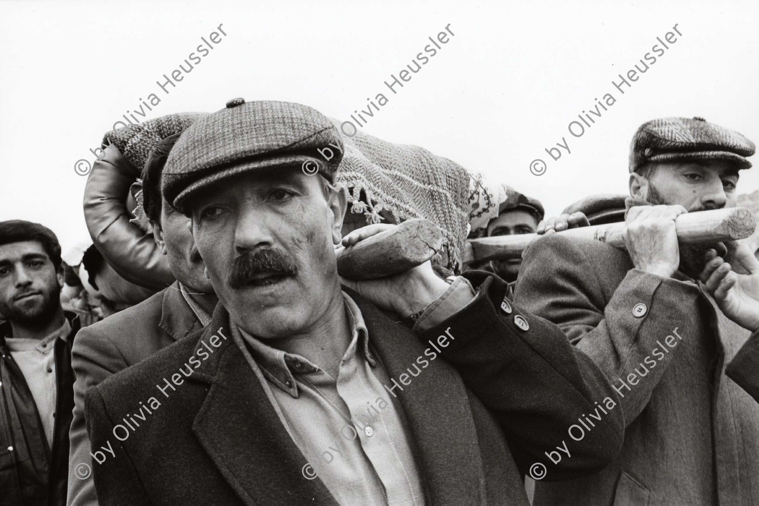 Image of sheet 19900990 photo 37: Kurdish peasants in sorrow during the funeral of Kudret Filiz (27) who had been killed by the Turkish army. Filiz had been shot during manifestation against the Turkish repression in Kurdistan. Region of Dabulö. Kurdish part of Turkey

Diese Männern und Bauern trauern um eine Freundin, die von den Militärs umgebracht wurde. Türkei Kurdistan Lice 1990
Lice (pronounced [ˈlidʒe]), (Kurdish: Licê) is a Kurdish district of Diyarbakır Province in Turkey. The population is 9,644 as of 2010. It is located 90 km (56 mi) from the capital, Diyarbakır. The mayor is Fikriye Aydın (BDP).
Türkei Kurden Kurdistan Kurdish Turkey Turkish 1990 √