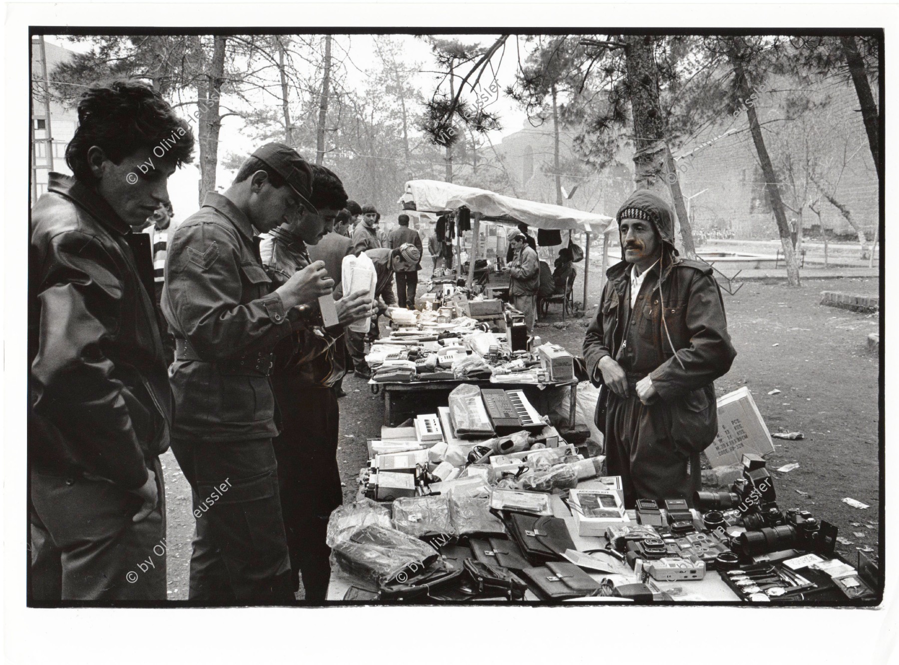 Image of sheet 19901070 photo 29: market shop open street 
Irakische Kurden leben als Flüchtlinge in Diyarbakir. Iraqi kurdish refugees in Turkey.
Kurds Kurdish Turkey Türkei Kurdische Ostanatolien 1990 √


Peshmerga or Peshmerge (Kurdish: پێشمەرگە Pêşmerge) is the term used by Kurds to refer to armed Kurdish fighters. Literally meaning "those who face death" (Pesh front + marg death) the Peshmerga forces of Kurdistan have been in existence since the advent of the Kurdish independence movement in the early 1920s, following the collapse of the Ottoman and Qajar empires which had jointly ruled over the area. Peshmerga forces include women in their ranks. Many Kurds will say that all Kurds willing to fight for their rights are Peshmerga. The term remains in contemporary usage, sometimes written as pesh merga in Anglophone media.