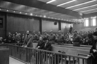 Image of sheet 19901090 photo 16: Prozess gegen die kurdischen Anwälte: Vedat Aydin, Zeki Okçuoğlu und Mustafa Oezer am Staatssicherheitsgericht in Ankara, 1990. Die angeklagten kurdischen Anwälte v.l.n.r. Vedat Aydin, Ahmet Zeki Okçuoğlu, und Mustafa Oezer während einem Prozess im Ankaraer Staatsgericht stehen vor dem Staatsrichter in der Anklagebank. Kurds Kurdish Turkey Ankara Dec. 1990 

Vor dem Eingang des Staatssicherheitsgericht.
Im Gericht half mir -
Lissy Schmidt (am 3.4.94 im Irak umgebracht) a German freelance journalist who worked with Agence France-Presse and the German newspapers Frankfurter Rundschau and Der Tagesspiegel, and a friend were shot and killed when gunmen opened fire on their car outside the city of Sulaymaniyah in the Kurdish-controlled area of northern Iraq.-
nach vorne zu den türkischen Berichterstatter zu sitzen und sie tat so, als wenn ich eine Türkin wäre. Dort fotografierte ich den Staatsrichter, was er nicht mochte und protestierte. Eine junge Verteidigerin sprach für mich ein Plädoyer aus. Ihre Augen funkelten nur so. Ich verstand sie nicht aber ich spührte eine wahnsinnige Kraft. Ich zwinkerte ihr dann zu.
Nr. 36 Mustafa Oezer steht in der Anklagebank. 
Türkei Kurdische Ostanatolien √
Press archive printed media published with the use of a photography by Olivia Heussler: .