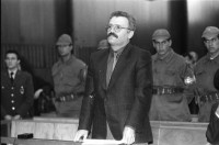 Image of sheet 19901100 photo 9: frtsg. 901090 Im Staatsgericht Ankara. Der Prozess um den kurdischen Anwalt Vedat Aydin Nr. 5, der im Juli 91 von Todesschwadronen umgebracht wurde. Im Prozess wurden alle drei wegen Kurdisch sprechens verklagt, und später frei gesprochen. Mi: Ahmet Zeki Okçuoğlu, und re: Mustafa Oezer (HEP). In der Anklagebank. Umringt von türkischen Militärs. Die Verteidiger Innen, über 100, zogen sich unter Protest zurück und führten später ihre Plädoyer aus dem Zuschauerraum. Turkey Kurdish Kurds
Die angeklagten kurdischen Anwälte v.l.n.r. Vedat Aydin, 

(Vedat Aydın, the Diyarbakır branch chairman of the now-defunct People’s Labor Party (HEP), was found dead on a road near Malatya on 7 July 1991, two days after armed men had taken him from his home in Diyarbakir. The widow Sükran Aydın thinks her husband’s murder was a turning point and that there was a sudden increase in the number of unsolved murders in the country’s Southeast following his death. She believes that a clandestine unit within the gendarmerie was responsible for the murder.[48] Only 18 years after the killing the public prosecutor in Diyarbakir opened a file seeking the detention of nine JITEM members including the Major Aytekin Özen)



Ahmet Zeki Okçuoğlu, und Mustafa Oezer während einem Prozess im Ankaraer Staatsgericht. Ahmet Zeki Okçuoğlu, ist 1999 einer der Verteidiger im Prozess gegen den Kurdenführer Oecalan. Öcalan Ankara Türkei 12.90