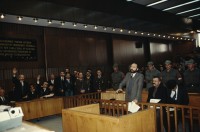 Image of sheet 19903006 photo 21: Im Staatsgericht Ankara. Der Prozess um den kurdischen Anwalt Vedat Aydin Nr. 5, der im Juli 91 von Todesschwadronen umgebracht wurde. Im Prozess wurden alle drei wegen Kurdisch sprechens verklagt, und später frei gesprochen. Mi: Ahmet Zeki Okçuoğlu, und re: Mustafa Oezer (HEP). In der Anklagebank. Umringt von türkischen Militärs. Die Verteidiger Innen, über 100, zogen sich unter Protest zurück und führten später ihre Plädoyer aus dem Zuschauerraum. Turkey Kurdish Kurds Die angeklagten kurdischen Anwälte v.l.n.r. Vedat Aydin, (Vedat Aydın, the Diyarbakır branch chairman of the now-defunct People’s Labor Party (HEP), was found dead on a road near Malatya on 7 July 1991, two days after armed men had taken him from his home in Diyarbakir.