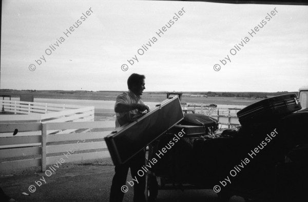 Image of sheet 19910710 photo 20: Vital Hauser lädt ein zur Hirschjagd in Gaick Lodge bei Kingussie. Wir kommen in Inverness an. Flughafen. Die Jagd Touristen vorallem aus den USA warten mit den Waffenscheinen auf ihr Gewehr. Lachs wird angeboten. Portrait Vital. Lange Koffer
sind für Gewehre.Nr. 28 Phillipe Vital mit Stumpen , Schiessübungen. Scotland Schottland Kingussie 1991

Scotland (Scottish Gaelic: Alba ([ˈal̪ˠapə ] About this sound listen (help·info)) is a country that is part of the United Kingdom. Occupying the northern third of the island of Great Britain, it shares a border with England to the south and is bounded by the North Sea to the east, the Atlantic Ocean to the north and west, and the North Channel and Irish Sea to the southwest. In addition to the mainland, Scotland is made up of more than 790 islands including the Northern Isles and the Hebrides. rifle arms fire airport luggage Europe ticket transport airport